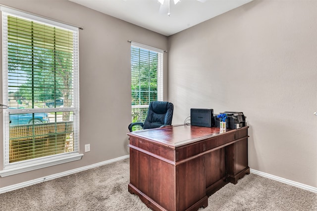 office featuring light carpet and ceiling fan