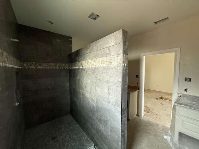 bathroom with concrete flooring