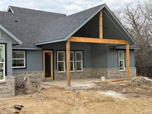 back of property with a patio