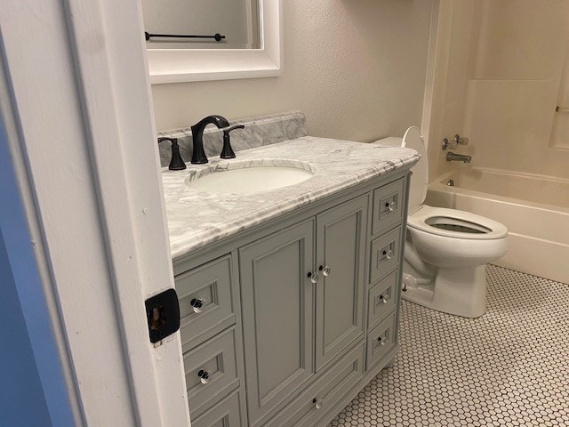 full bath with toilet, bathtub / shower combination, and vanity