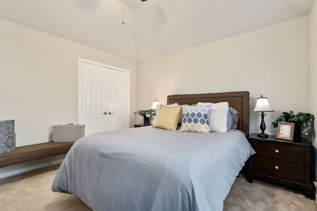 carpeted bedroom featuring a closet and ceiling fan