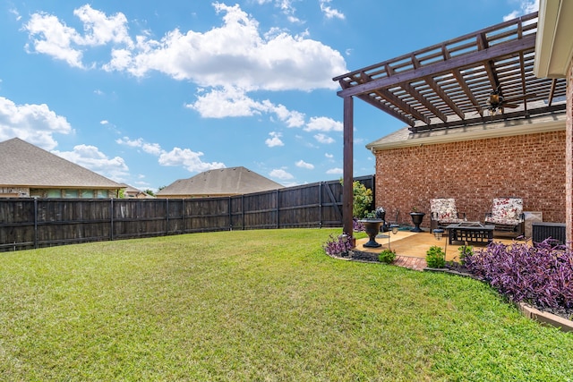 view of yard featuring ceiling fan, a patio area, and a pergola