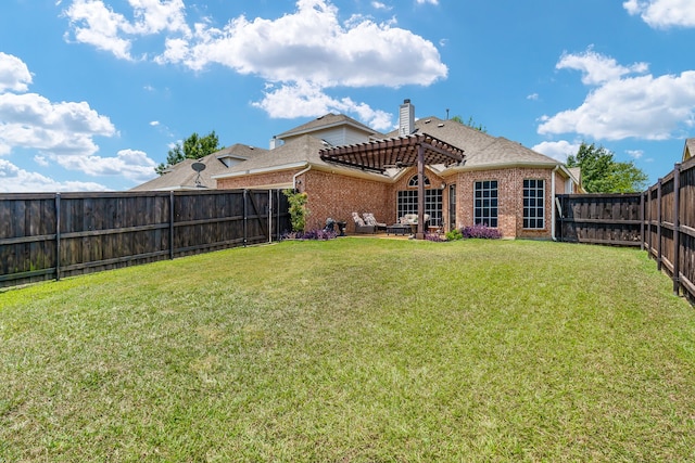 rear view of house featuring a lawn