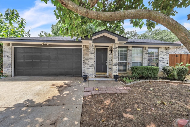 single story home featuring a garage