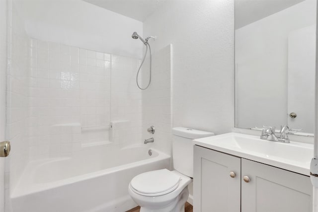 full bathroom with vanity, toilet, and  shower combination