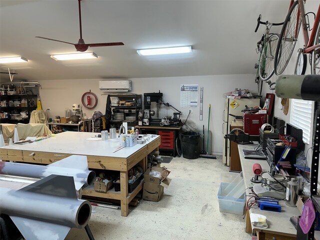 garage featuring ceiling fan, a wall mounted AC, and a workshop area