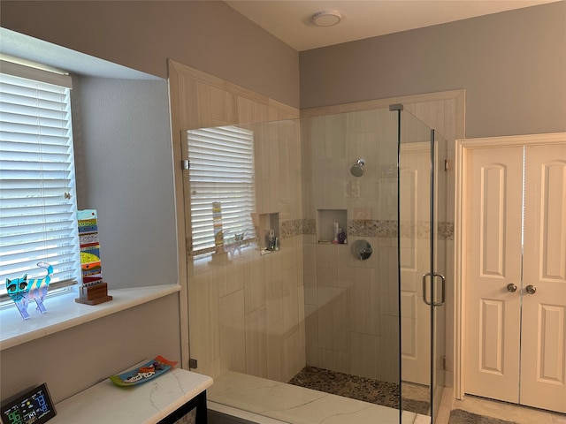 bathroom featuring an enclosed shower