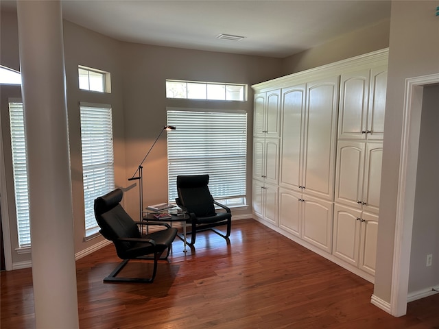 living area with hardwood / wood-style flooring