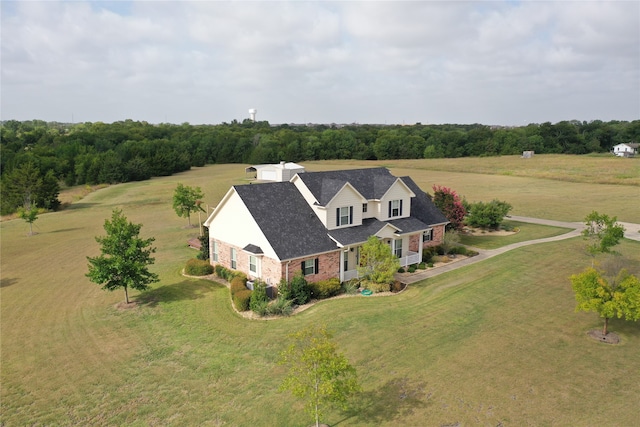 birds eye view of property with a rural view