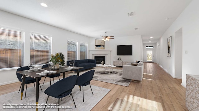 dining space featuring plenty of natural light, light hardwood / wood-style floors, and ceiling fan