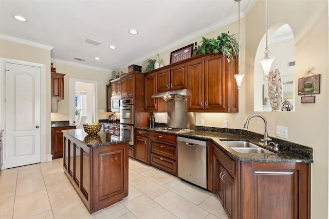 kitchen with dark stone counters, stainless steel appliances, pendant lighting, sink, and light tile patterned floors