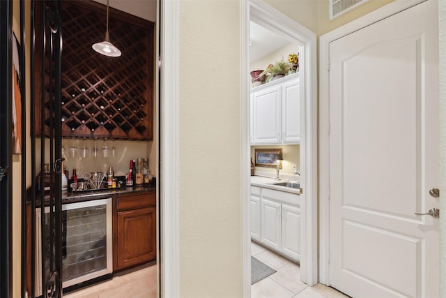 649 Oak Tree Cv, Cedar Hill, TX 75104 - wine area with wine cooler, light tile patterned floors, and wet bar
