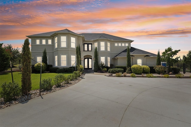 649 Oak Tree Cv, Cedar Hill, TX 75104 - view of front facade featuring stucco siding, french doors, and a lawn