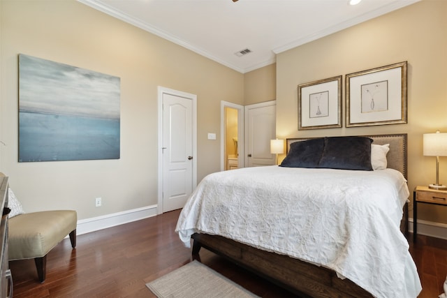 bedroom with ornamental molding and dark hardwood / wood-style floors