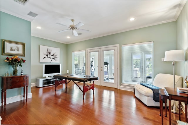 playroom with wood-type flooring, ceiling fan, french doors, and crown molding