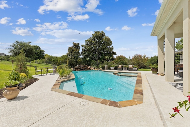 view of swimming pool with a patio area