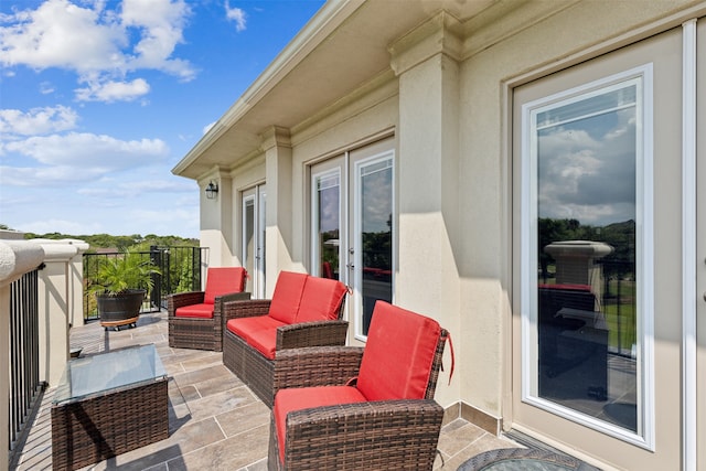 exterior space with a balcony and an outdoor living space