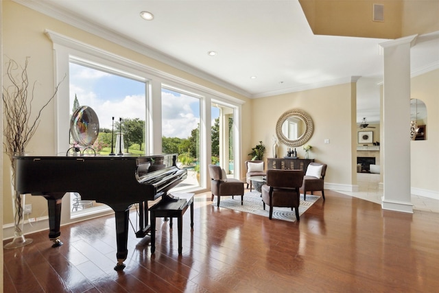 649 Oak Tree Cv, Cedar Hill, TX 75104 - living area with wood finished floors, baseboards, crown molding, recessed lighting, and ornate columns