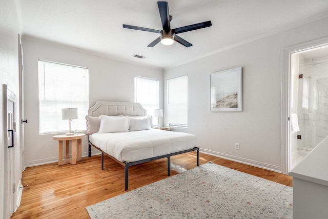 bedroom featuring light hardwood / wood-style floors, ornamental molding, connected bathroom, and ceiling fan