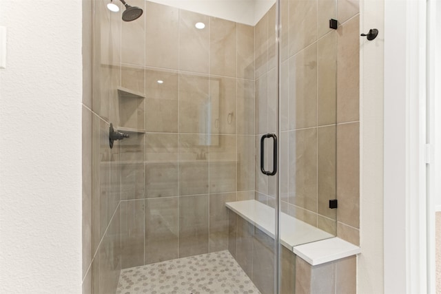 bathroom featuring an enclosed shower