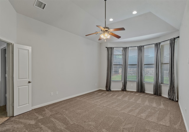 spare room featuring ceiling fan and carpet