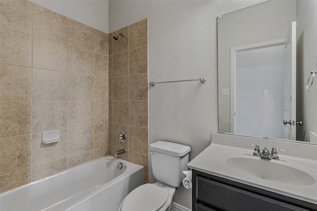 full bathroom featuring vanity, toilet, and tiled shower / bath combo