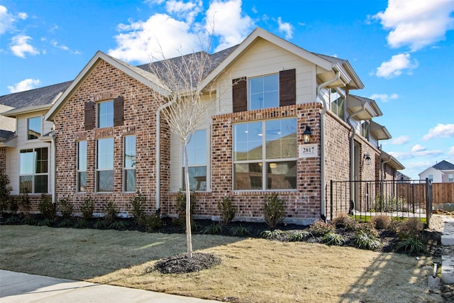 view of property featuring a front yard