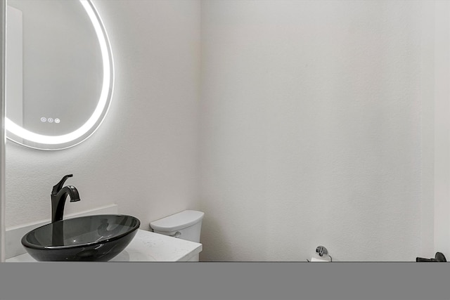 bathroom with sink and toilet