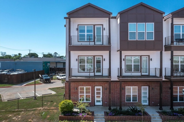 view of front of home with a balcony