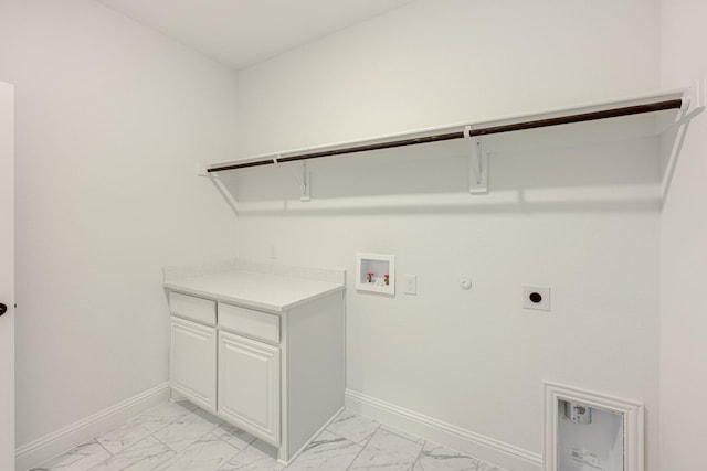 laundry area with hookup for an electric dryer, gas dryer hookup, baseboards, and marble finish floor