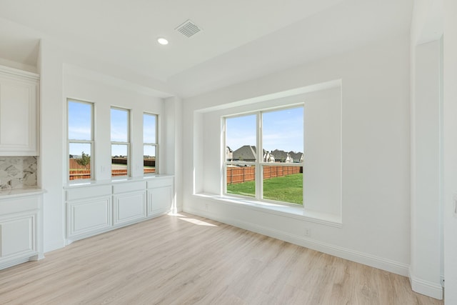 interior space with visible vents, recessed lighting, light wood finished floors, and baseboards