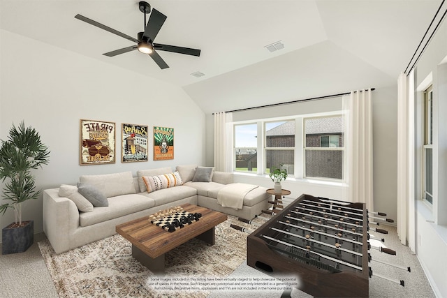 carpeted living room featuring ceiling fan and lofted ceiling