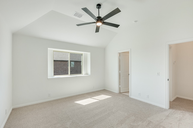 unfurnished room featuring lofted ceiling, light colored carpet, and ceiling fan