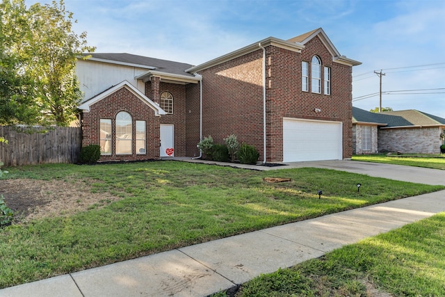 view of property featuring a garage and a front lawn