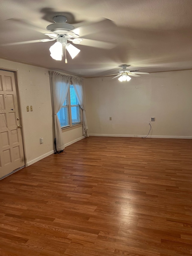 unfurnished bedroom with ceiling fan and wood-type flooring