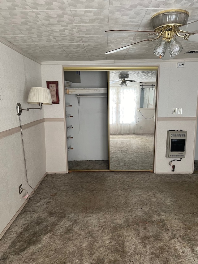 interior space with ceiling fan and carpet flooring