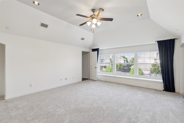 unfurnished room with light carpet, vaulted ceiling, and ceiling fan