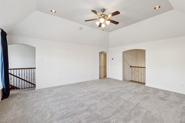 carpeted empty room with lofted ceiling and ceiling fan