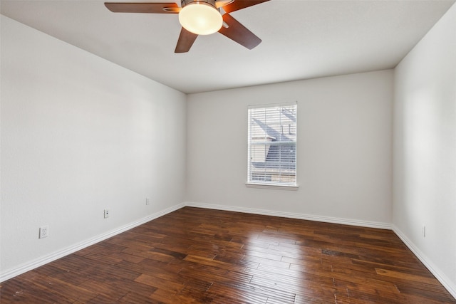 empty room featuring dark hardwood / wood-style floors and ceiling fan