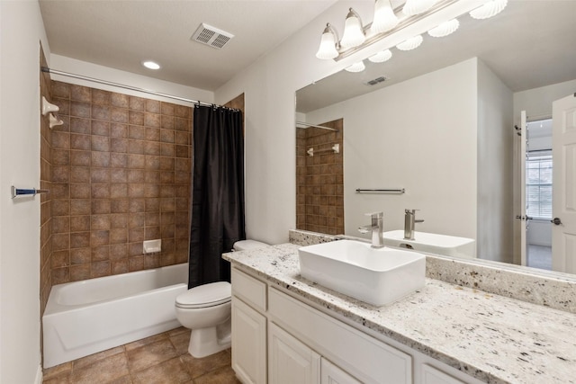 full bathroom featuring vanity, shower / bath combination with curtain, and toilet