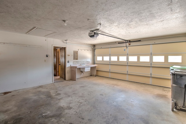 garage with sink and a garage door opener