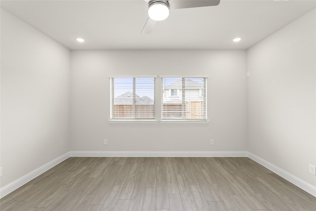 empty room featuring ceiling fan and light wood-type flooring