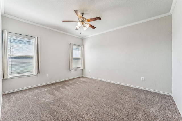 empty room with ceiling fan, carpet, a textured ceiling, and ornamental molding