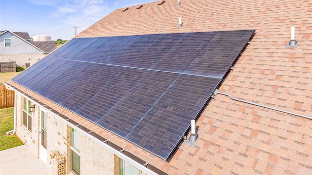 view of home's exterior featuring solar panels