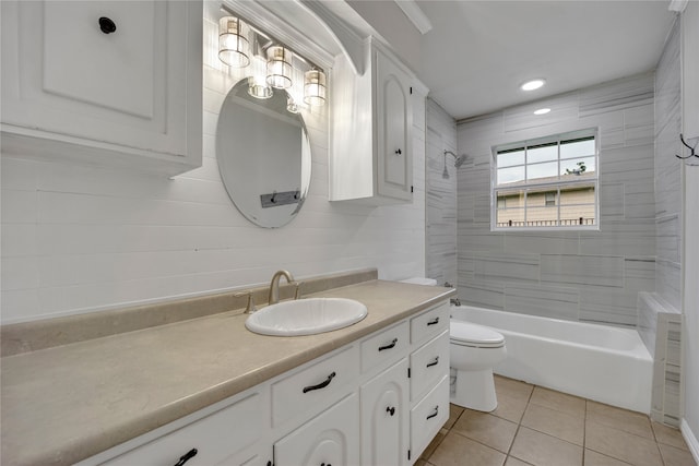 full bathroom with vanity, tiled shower / bath, tile patterned flooring, and toilet