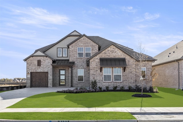 view of front facade with a garage and a front yard