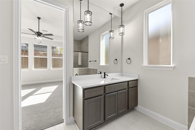 bathroom featuring ceiling fan, tile patterned floors, and vanity