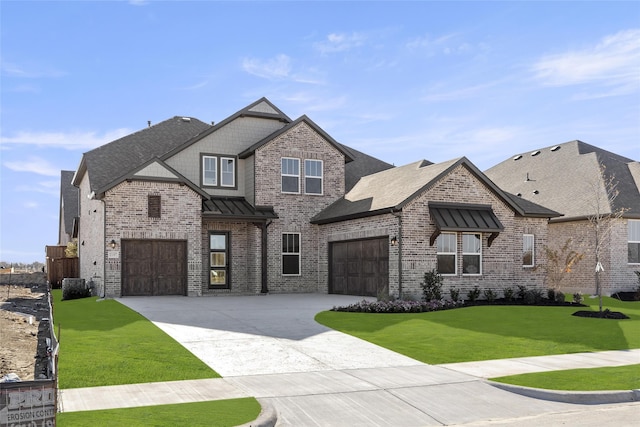 view of front of home featuring a garage and a front yard