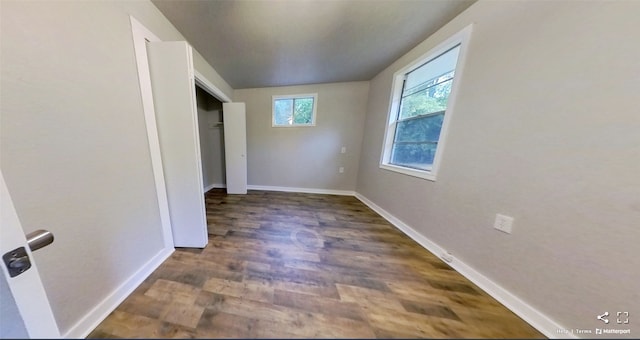 unfurnished bedroom featuring dark hardwood / wood-style floors