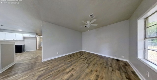 spare room featuring ceiling fan, hardwood / wood-style floors, and vaulted ceiling